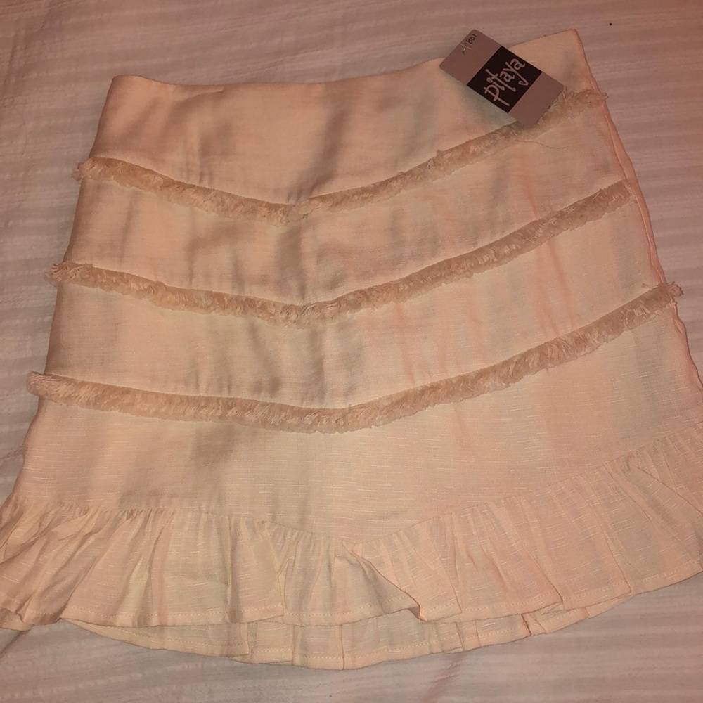White ruffled skirt